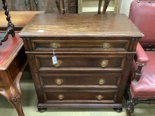 A 17th century style oak chest of four drawers, width 91cm, ...