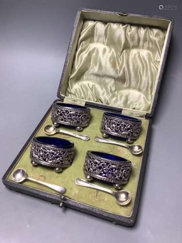 A cased set of four Edwardian, pierced silver oval salts, wi...