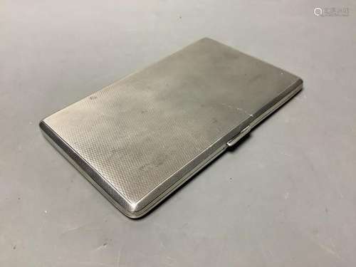 A George VI engine turned silver rectangular cigarette case,...