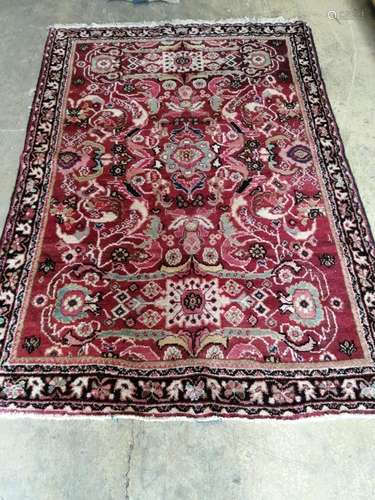 A North West Persian red ground rug, 210 x 140cm