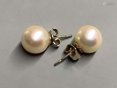A pair of white metal and cultured pearl stud earrings.