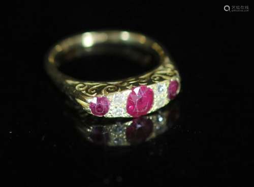 An early 20th century 18ct gold, three stone ruby and four s...