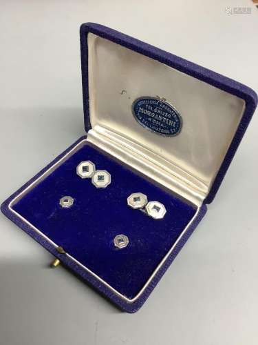 A cased four piece white metal (stamped 750) and sapphire se...