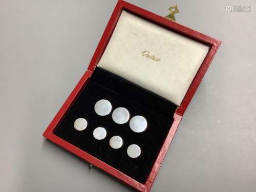 A cased set of seven sterling white metal buttons (two sizes...