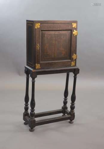 An early 18th century European japanned cabinet on stand,the...