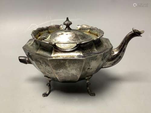 A late Victorian small silver teapot, of oval twelve-sided f...