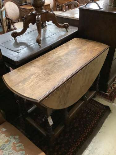 An 18th century oak gateleg table, width 116cm, depth 118cm,...