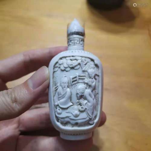 Snuff bottles with white porcelain figures carved by Wang Bi...