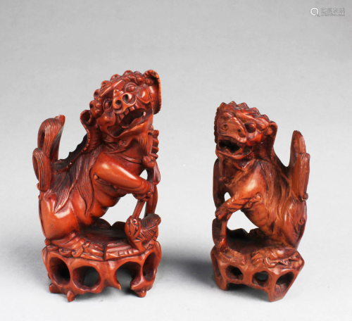 A Group of Two Carved Wooden Foo Lion Display