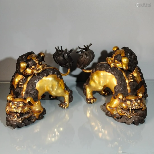 A pair of red copper gilt real gold lion and young lion