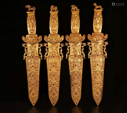 A collection of the four gilt daggers of the Qing