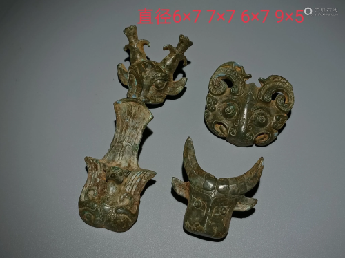 A set of Shang animal face buckle, the size is shown in