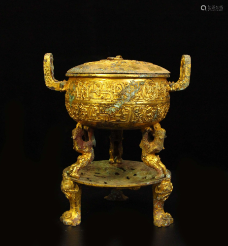 The gilt bronze round tripod from the collection of