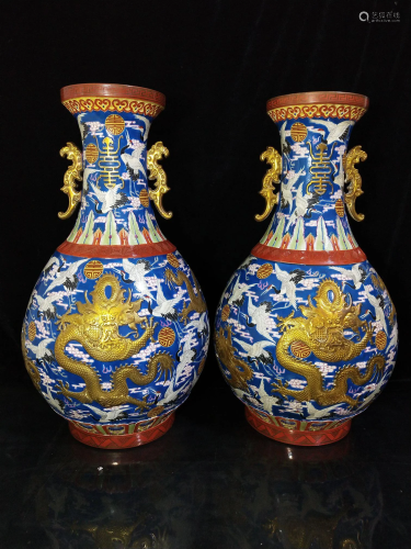 A pair of double-eared vases with embossed dragon