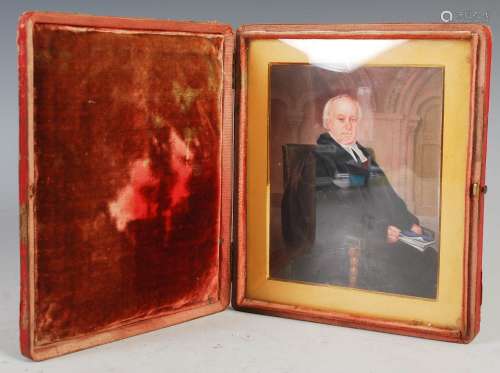 A 19th century portrait miniature of a clergyman, three quar...
