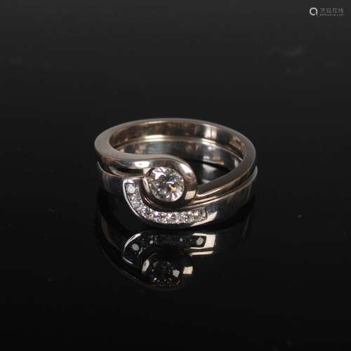 PRISM DESIGN, Two 18ct white gold and diamond rings, of inte...