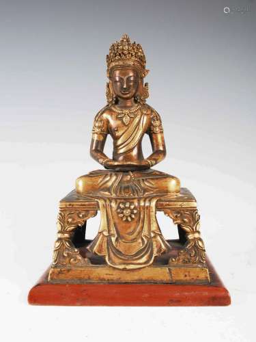 A Chinese gilt bronze figure of Buddha, Qing Dynasty, seated...