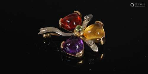 A yellow and white metal multi-gem set flower brooch, circa ...