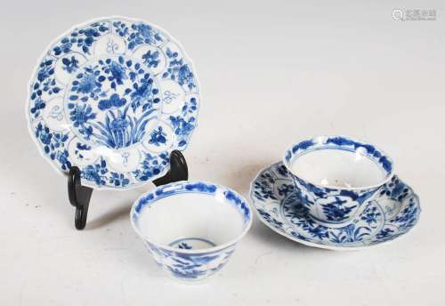 A pair of Chinese porcelain blue and white tea bowls and sau...