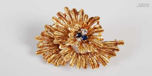 An 18ct gold sapphire and diamond brooch, circa 1970, set wi...