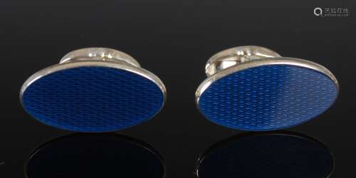 PHILIP KYDD, A pair of silver and blue enamel oval cufflinks...
