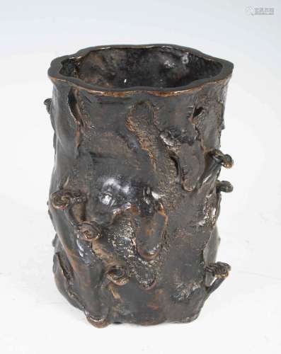 A Chinese bronze brush pot, Qing Dynasty, modelled in the fo...