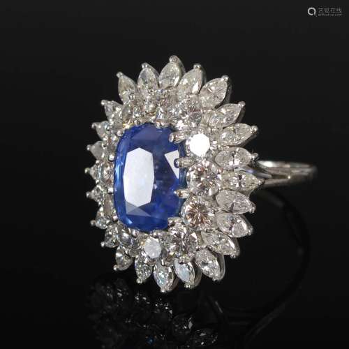 A white metal sapphire and diamond cluster ring, 20th centur...