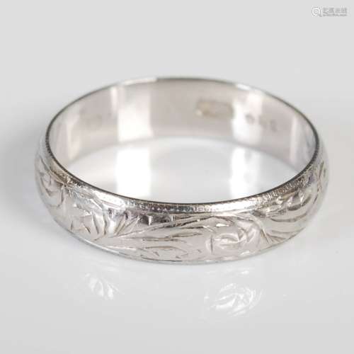A platinum wedding ring, London, 1979, makers mark of S&W fo...