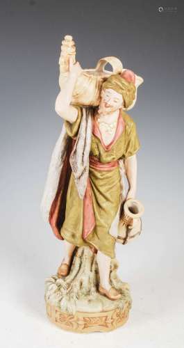 A Royal Dux figure of a water carrier, applied and impressed...