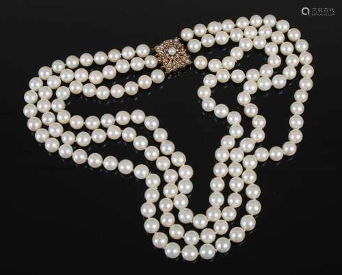 A cultured pearl necklet with 9ct gold and pearl set clasp, ...