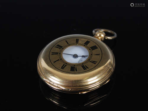 A yellow metal half hunter pocket watch, the outer cover wit...