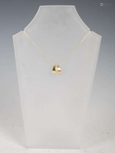 LAUREL JEWELLERY, A 9ct two-colour gold and diamond pendant,...