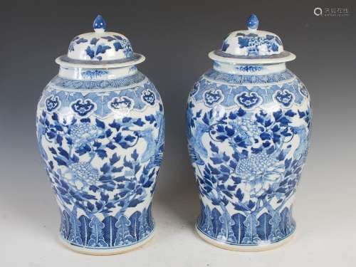 A pair of Chinese porcelain blue and white jars and covers, ...