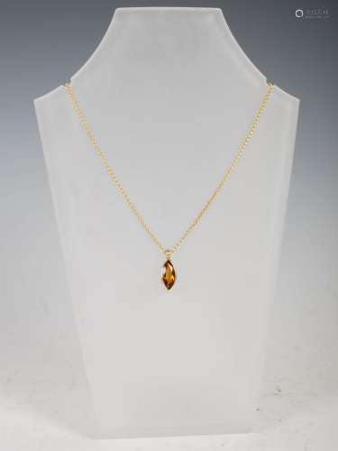 MISTRAL DESIGN, A 9ct yellow gold pendant, set with a facete...