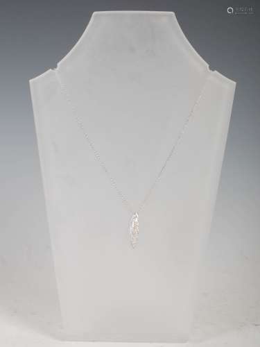 A 9ct white gold and diamond pointed oval pendant, with pave...