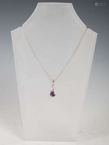 PRISM DESIGN, A 9ct white gold, amethyst and diamond scroll-...