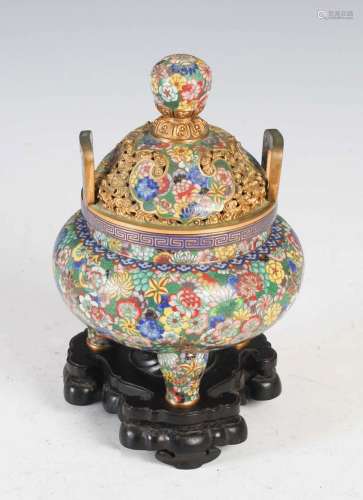 A Chinese cloisonne enamel and gilt metal twin handled tripo...