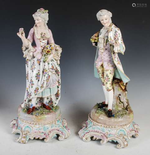 A pair of late 19th century Dresden porcelain figures, the m...