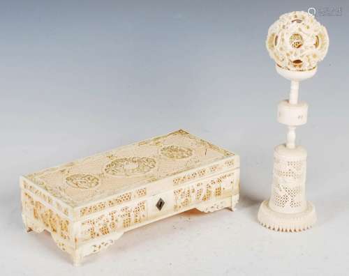 A Chinese ivory puzzle ball on stand and a Chinese ivory cas...