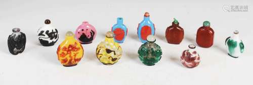 A collection of ten Chinese overlay glass snuff bottles and ...