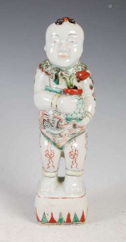 A Chinese porcelain famille verte figure of a boy, Qing Dyna...