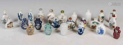 A collection of twenty four Chinese porcelain snuff bottles,...