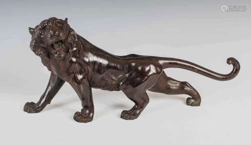 A Japanese bronze tiger, Meiji Period, signed, 55cm wide x 2...