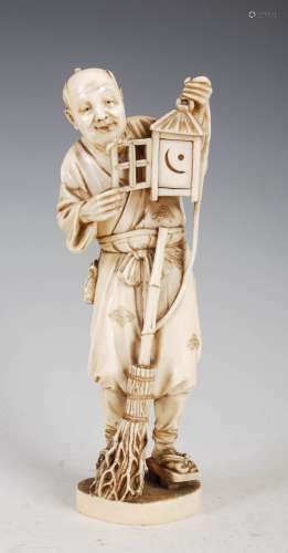 A Japanese ivory okimono of a lantern lighter, Meiji Period,...