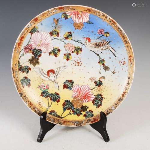 A Japanese Satsuma pottery charger, Meiji Period, decorated ...