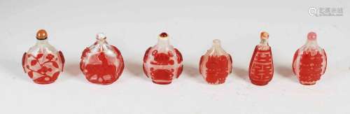 A collection of six Chinese red glass overlay snuff bottles,...