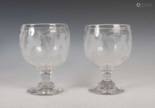 A pair of oversized 19th century glass goblets, the circular...