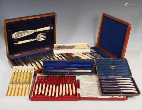 An oak cased set of twelve silver mounted fish knives, forks...