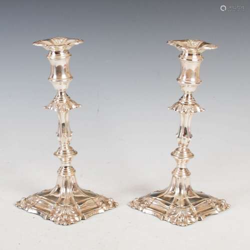 A pair of Edwardian silver candlesticks in the George III st...