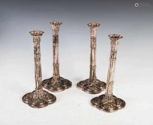 A set of four George III silver candlesticks, London, 1766, ...